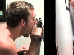 Sexy gay rubbing and sucking cock on gloryhole