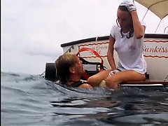 Jacqueline Bisset scuba diving in a white t-shirt that