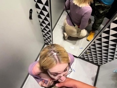 Gf gives a blowjob in the changing booth